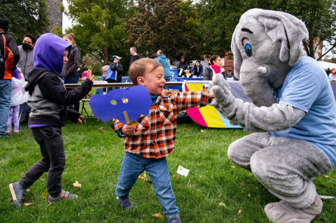 children and a person in an elephant costume at Tufts Community Day