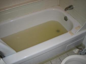 Tub with dirty colored water 