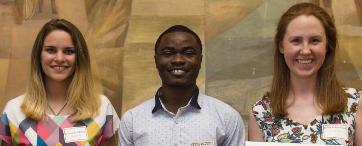 Three Graduate Students holding their Honos Civicus Awards