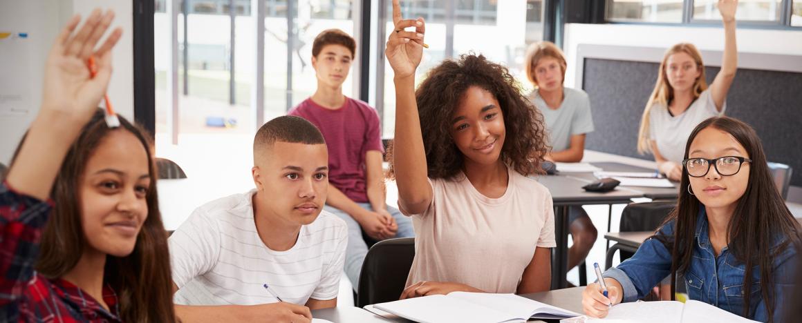 High school students raising hands