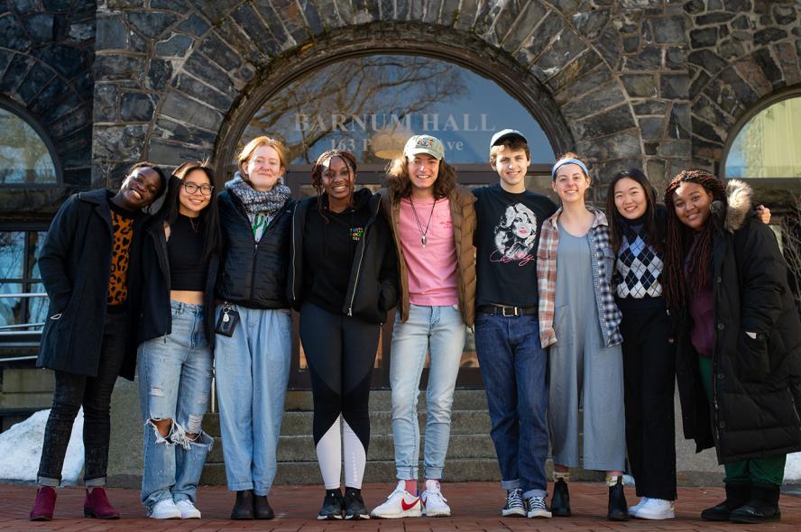 Nine Civic Semester students stand together in front of Tisch College of Civic Life at Tufts University