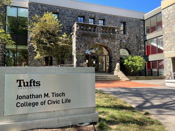 Barnum Hall in the background with the Jonathan M. Tisch College of Civic Life sign in the foreground