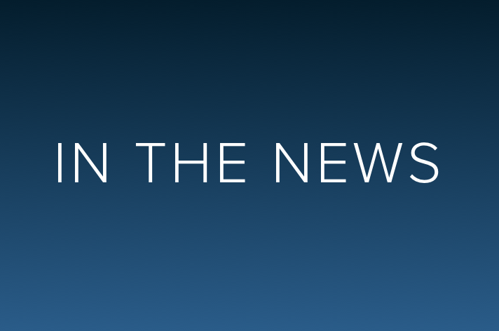 blue background with the words "IN THE NEWS"