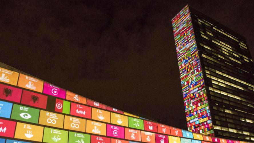 Photo of multi-colored logos at the U.N. building. 
