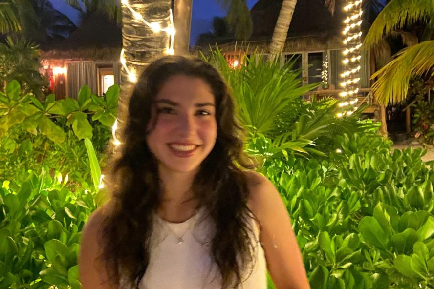 Image of Belen Arbelaez, in front of plants and trees