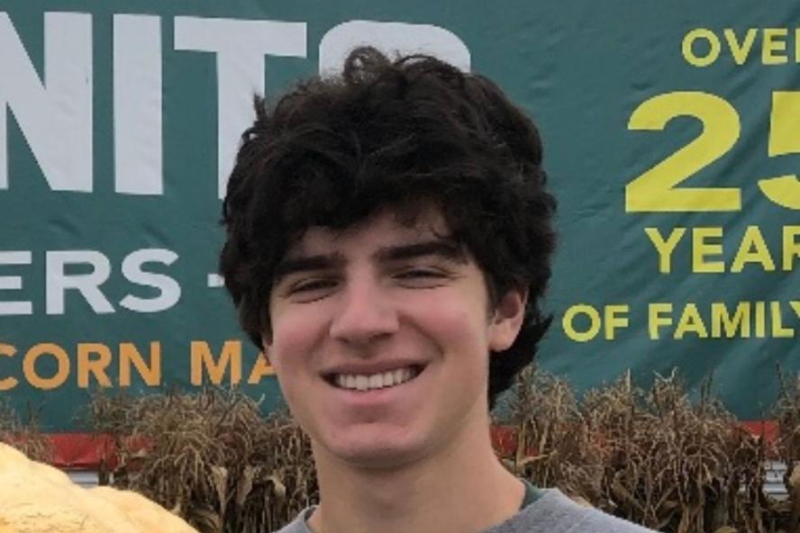 Image of Bernard, in front of a corn maze