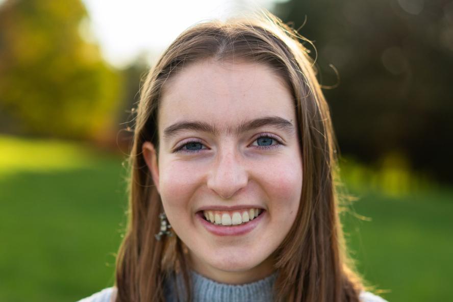 Image of Michela, civic semester student, in front of green background