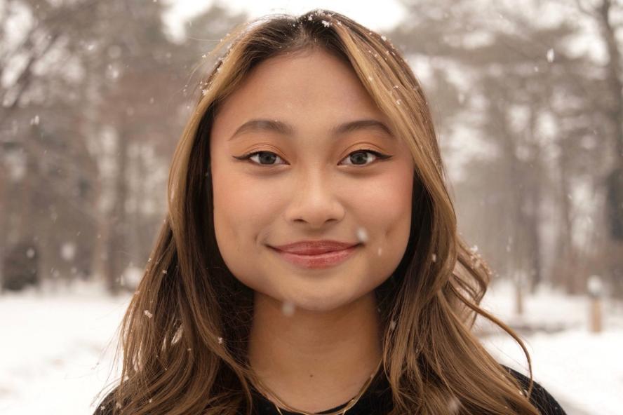 Image of Vorleak Hak, a civic semester student, in front of snow