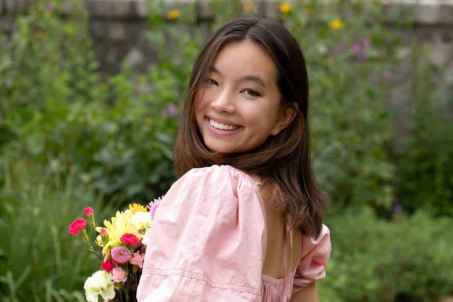 Image of Natalie, a civic semester student, holding flowers