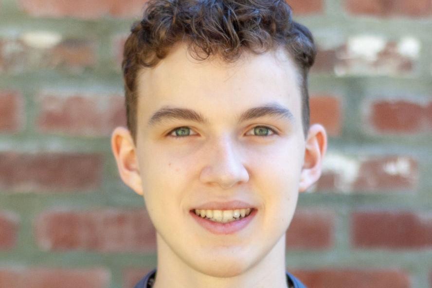 Image of Raphael Beauchemin, a civic semester student, in front of brick wall