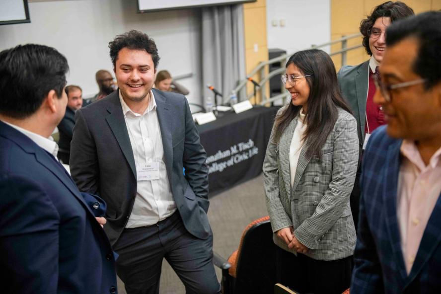 Students and speakers mingle at the Democracy on the Brink symposium