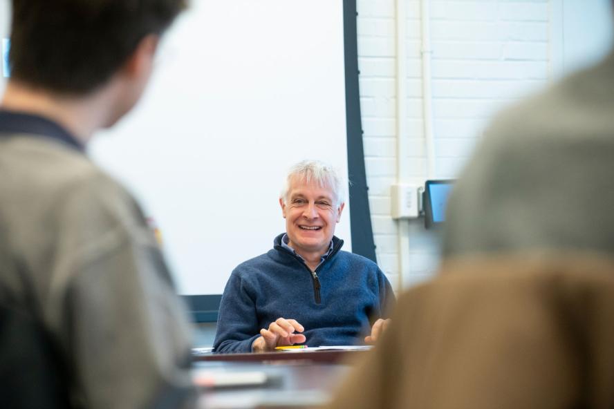 Peter Levine siting in a classroom talking