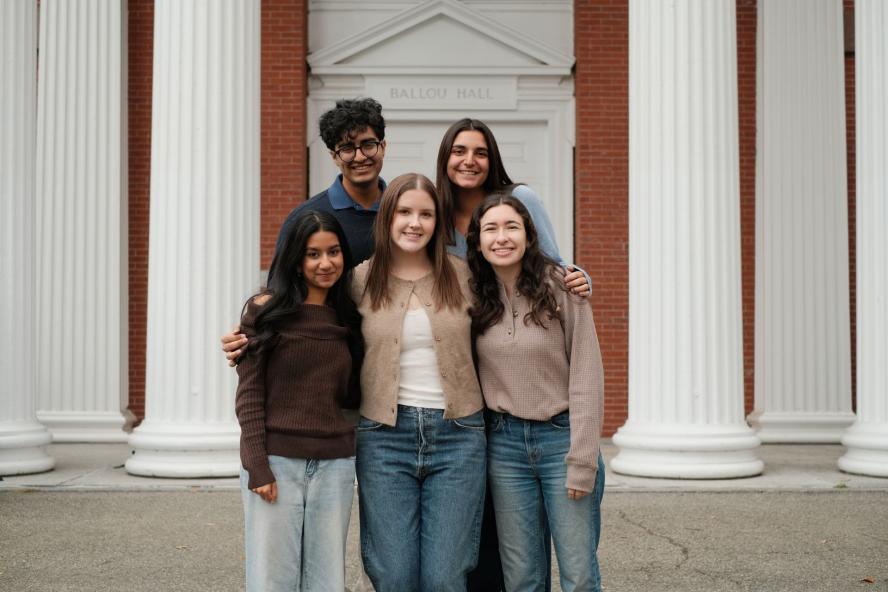 LCS leadership team poses outside of Ballou Hall on Tufts campus