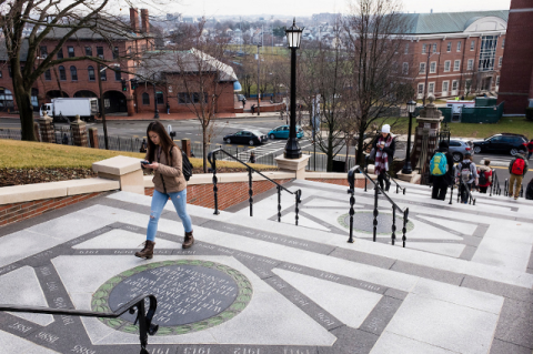 Students walk up Memorial Steps on Tufts University's campus