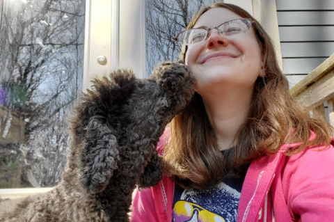 dog licking a person's face