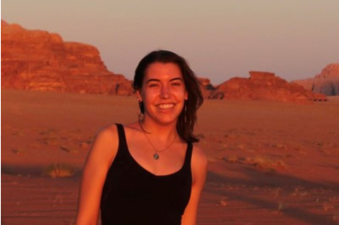 Alexandra Dingle Headshot outside in front of red rocks