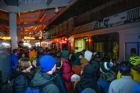 Crowds gather on the T platform, waiting to get on to Green Line trains. The MBTA Green Line makes its debut at the Medford/Tufts stop on December 12.